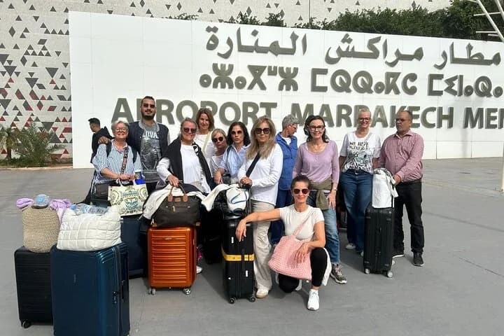 MTS Transfers guests with their luggage in front of Marrakech Menara Airport (RAK)