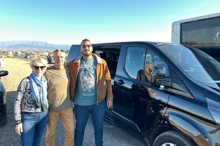 MTS Transfers driver with a couple beside a private minivan