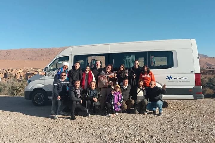 Group of travellers with an MTS Transfers minibus